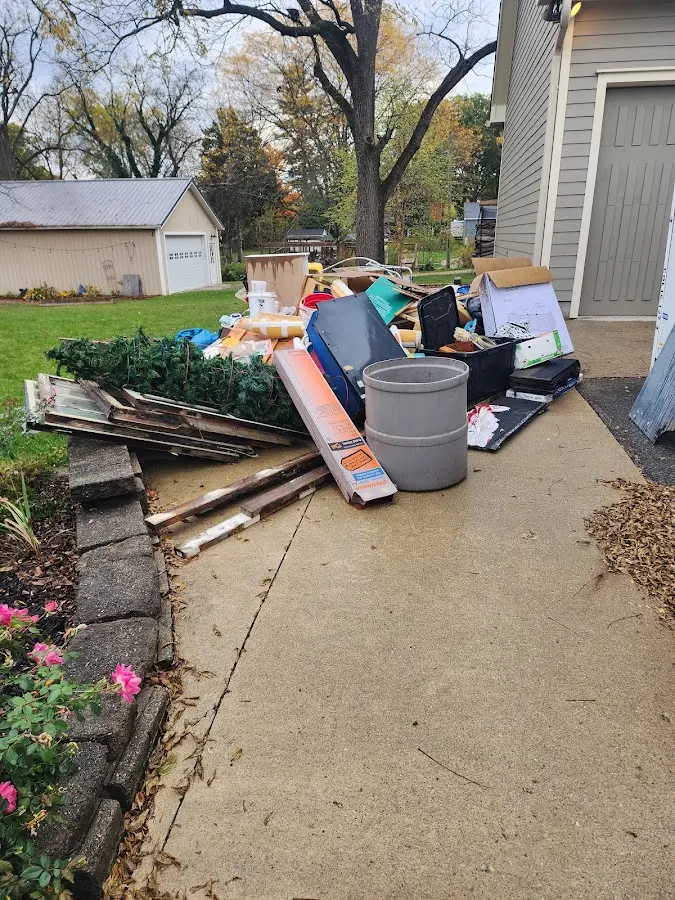 Dumpster being loaded with debris for Commercial Dumpster Rental in Strawberry